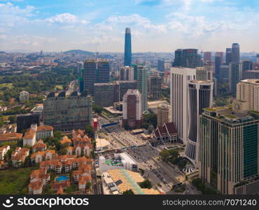 Aerial view of Kuala Lumpur Downtown, Malaysia. Financial district and business centers in smart urban city in Asia. Skyscraper and high-rise buildings at sunset.