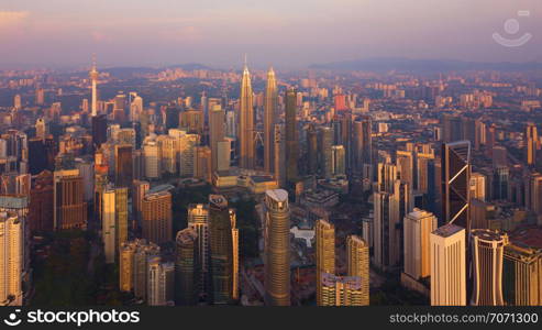 Aerial view of Kuala Lumpur Downtown, Malaysia. Financial district and business centers in smart urban city in Asia. Skyscraper and high-rise buildings at sunset.