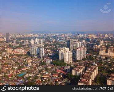 Aerial view of Kuala Lumpur Downtown, Malaysia. Residential houses district in urban city in Asia. Buildings at noon.
