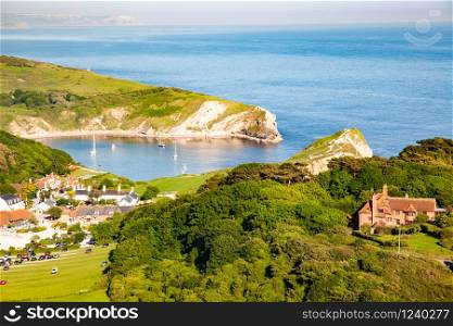 aerial view of Lullworth cove on Jurassic Coast of Dorset, UK- British summer holiday destination
