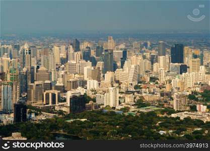 Aerial view of Lumpini park, Sathorn, Bangkok Downtown. Financial district and business centers in smart urban city in Asia. Skyscraper and high-rise buildings.