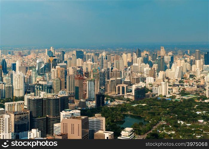 Aerial view of Lumpini park, Sathorn, Bangkok Downtown. Financial district and business centers in smart urban city in Asia. Skyscraper and high-rise buildings.
