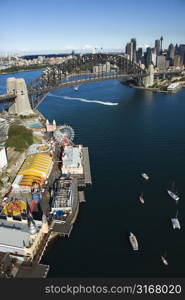 Aerial view of Luna Park Sydney, Australia with boats in Sydney harbour and view of Sydney Harbour Bridge.