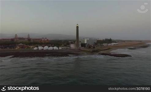 Aerial view of Maspalomas Lighthouse and resort on the coast of Gran Canaria. Evening scene
