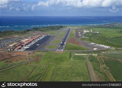 Aerial view of Maui, Hawaii airport with Pacific ocean.