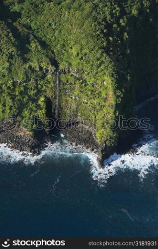 Aerial view of Maui, Hawaii coast with waterfall.