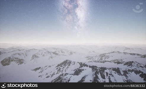 aerial view of Milky Way above snow covered terrain