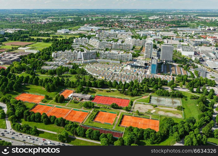 Aerial view of Munich Olympic village and tennis couts  from Olympiaturm (Olympic Tower). Munich, Bavaria, Germany. Aerial view of Munich, Germany