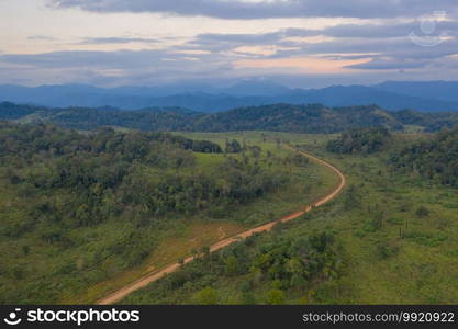 Aerial view of national park green field mountains in Thung Yai Naresuan Wildlife Sanctuary, Umphang District in Tak, Thailand. Wildlife diversity, plants at sunset.