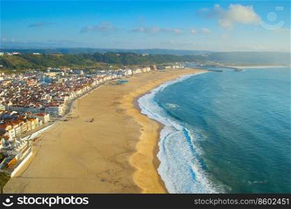 Aerial view of Nazare beach and city at sunset. Portugal