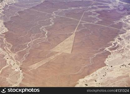 Aerial view of nazca lines representing a triangle in a desert, Nazca, Peru