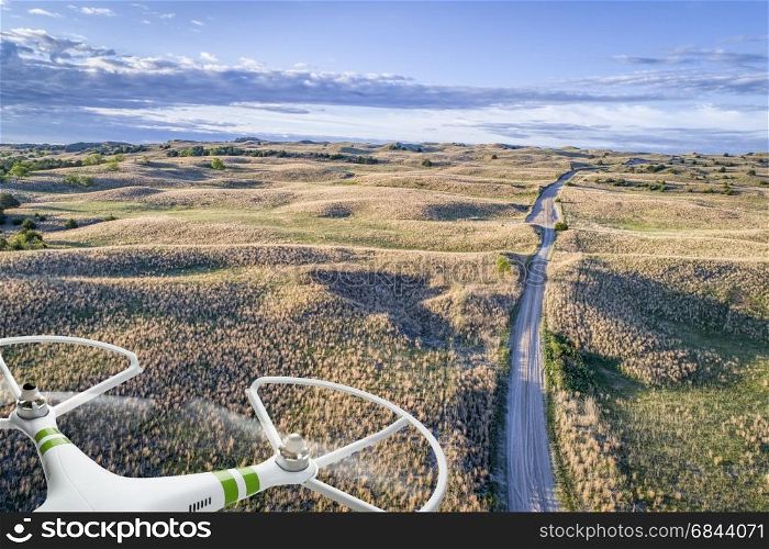 aerial view of Nebraska Sand Hills. aerial view of a farm road in Nebraska Sand Hills with a flying drone