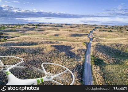 aerial view of Nebraska Sand Hills. aerial view of a farm road in Nebraska Sand Hills with a flying drone