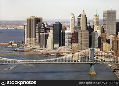 Aerial view of New York City&acute;s Manhattan Bridge with Brooklyn Bridge and Manhattan buildings in background.