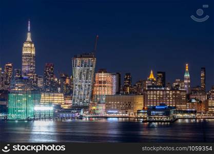 Aerial view of New York city Mid town Skylines cityscape from New Jersey at dusk