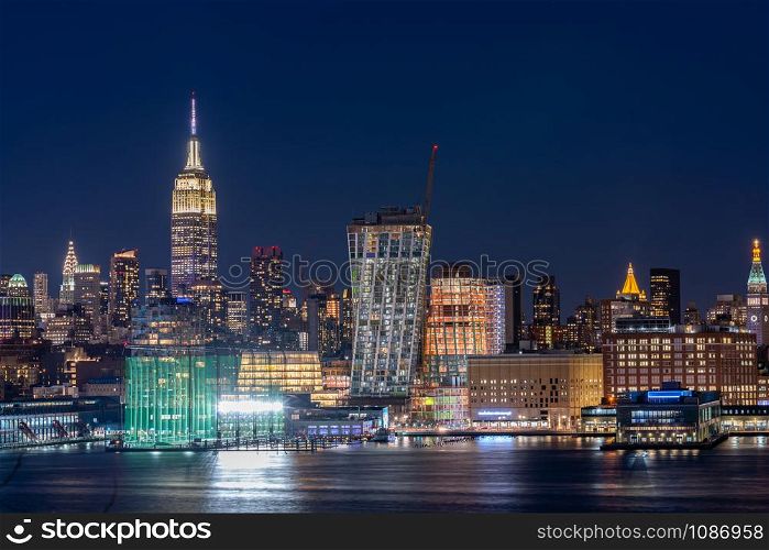Aerial view of New York city Mid town Skylines cityscape from New Jersey at dusk