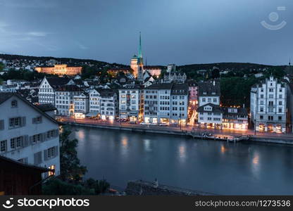 Aerial view of Old Town and river Limmat during morning blue hour in Old Town of Zurich, the largest city in Switzerland. Zurich, largest city in Switzerland