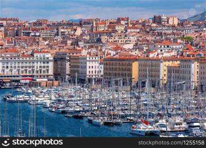 Aerial view of Old Vieux Port on sunny day in the historical city center of Marseilles, France. Old Port and Notre Dame, Marseille, France