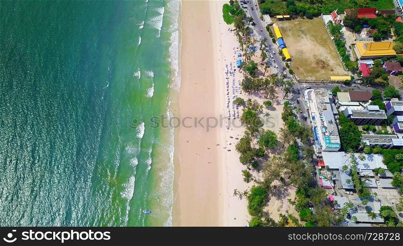 Aerial view of Patong beach, Phuket island and sea in summer, and urban city with blue sky for travel background, Andaman ocean, Thailand.