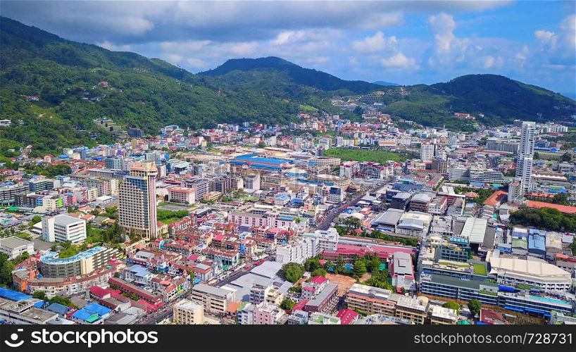 Aerial view of Patong beach, Phuket island and sea in summer, and urban city with blue sky for travel background, Andaman ocean, Thailand.