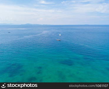 Aerial view of Patong beach with blue turquoise seawater, mountain hills, and tropical green forest trees with Andaman sea in Phuket island in summer, Thailand in travel trip. Nature background.