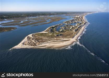 Aerial view of peninsula with beach and buildings in Murrells Inlet, South Carolina.
