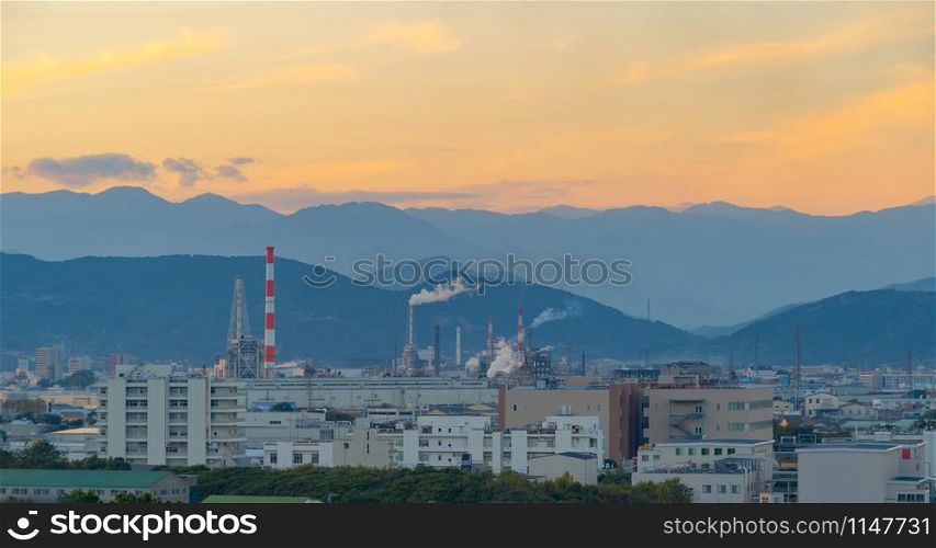 Aerial view of petrochemical oil refinery and sea in industrial engineering concept in Shizuoka district, urban city, Japan. Oil and gas tanks pipelines in industry. Modern metal factory.