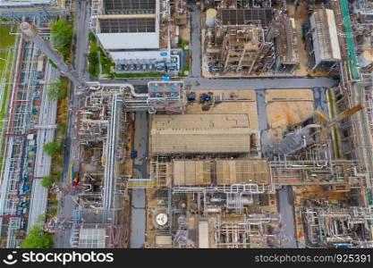 Aerial view of petrochemical oil refinery and sea in industrial engineering concept in Bangna district, Bangkok City, Thailand. Oil and gas tanks pipelines in industry. Modern metal factory.