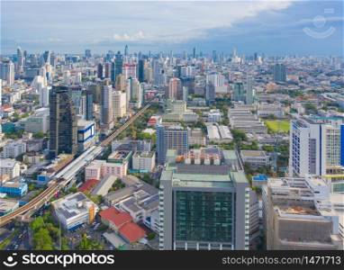 Aerial view of Phaya Thai district, Bangkok Downtown Skyline. Thailand. Financial district and business centers in smart urban city in Asia. Skyscraper and high-rise buildings at sunset.