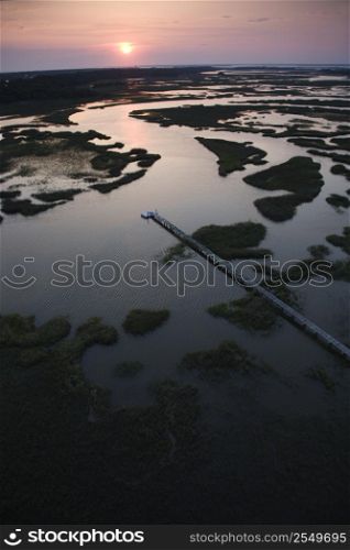 Aerial view of pier in coastal wetland on Bald Head Island, North Carolina.