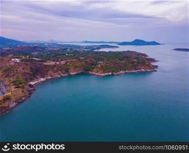 Aerial view of Promthep Cape viewpoint at sunset with Andaman sea in Phuket Island, tourist attraction in Thailand in travel trip and holidays vacation. Natural landscape wallpaper background.