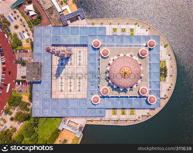 Aerial view of Putra mosque with garden landscape design and Putrajaya Lake, Putrajaya. The most famous tourist attraction in Kuala Lumpur City, Malaysia. Top view