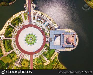 Aerial view of Putra mosque with garden landscape design and Putrajaya Lake, Putrajaya. The most famous tourist attraction in Kuala Lumpur City, Malaysia