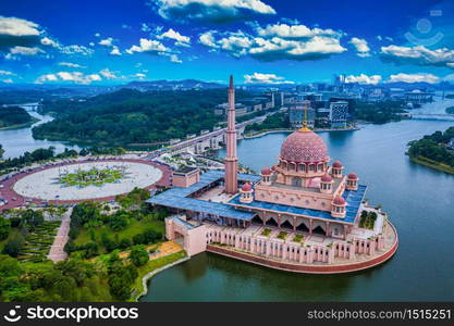 Aerial View Of Putra Mosque with Putrajaya City Centre with Lake at sunset in Putrajaya, Malaysia.