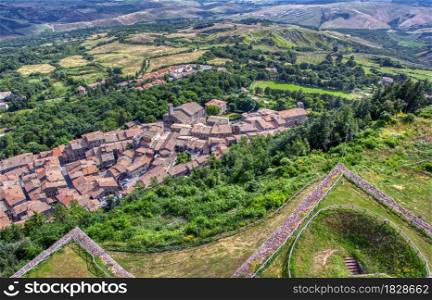 Aerial view of Radicofani town,Tuscany,Italy. The church of San Pietro in the central square of the town