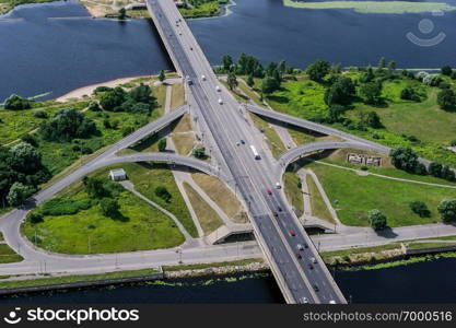 Aerial view of Riga city- capital of Latvia. Road with moving cars. Riga from above.