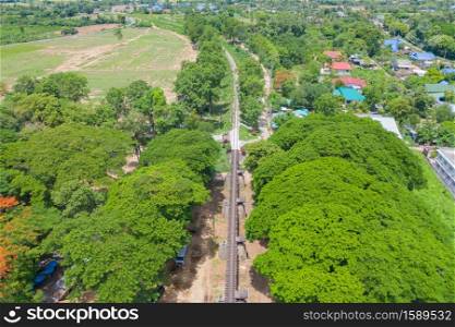 Aerial view of River Kwai Bridge with train rail way with Chao Phraya River, Tha Ma Kham, Mueang Kanchanaburi District, Thailand.
