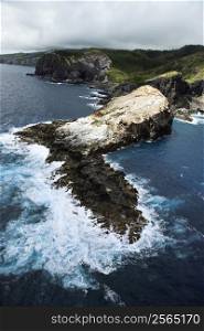 Aerial view of rocky cliffs on coastline of Maui, Hawaii.