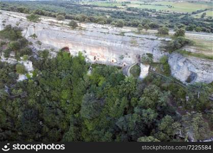 Aerial view of Saint Bernabe Ancient Heremitage in a cave in Ojo Guarena, Burgos, Spain. High quality 4k footage. Aerial view of Saint Bernabe Ancient Heremitage in a cave in Ojo Guarena, Burgos, Spain.