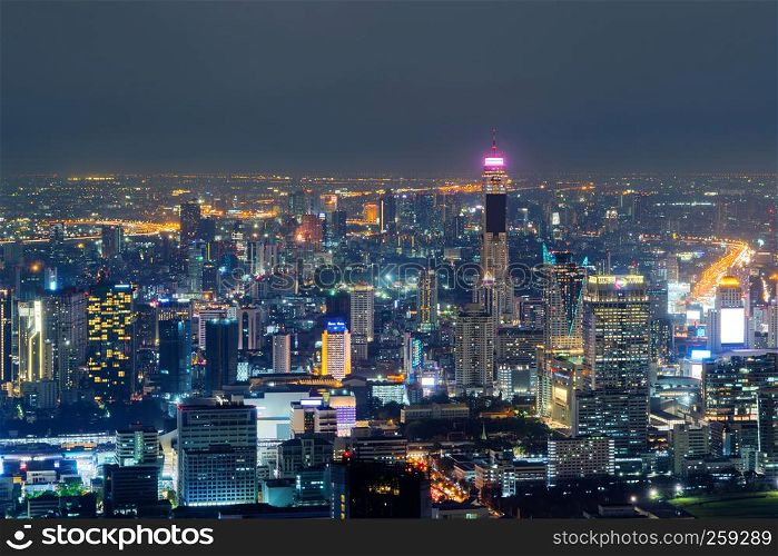Aerial view of Sathorn, Bangkok Downtown. Financial district and business centers in smart urban city in Asia. Skyscraper and high-rise buildings at night.