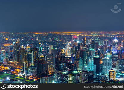 Aerial view of Sathorn, Bangkok Downtown. Financial district and business centers in smart urban city in Asia. Skyscraper and high-rise buildings at night.