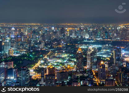 Aerial view of Sathorn, Bangkok Downtown. Financial district and business centers in smart urban city in Asia. Skyscraper and high-rise buildings at night.