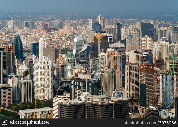 Aerial view of Sathorn, Bangkok Downtown. Financial district and business centers in smart urban city in Asia. Skyscraper and high-rise buildings.