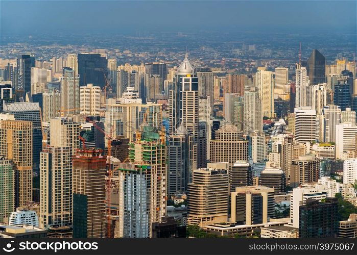 Aerial view of Sathorn, Bangkok Downtown. Financial district and business centers in smart urban city in Asia. Skyscraper and high-rise buildings.