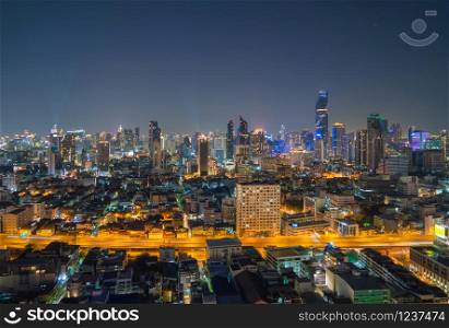 Aerial view of Sathorn district, Bangkok Downtown Skyline. Thailand. Financial district and business centers in smart urban city in Asia. Skyscraper and high-rise buildings at night.