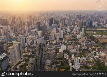 Aerial view of Sathorn district, Bangkok Downtown Skyline. Thailand. Financial district and business centers in smart urban city in Asia. Skyscraper and high-rise buildings at sunset.
