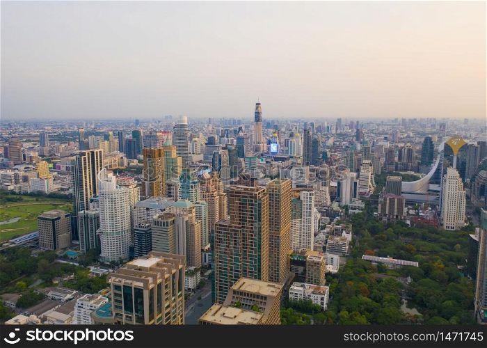Aerial view of Sathorn district, Bangkok Downtown Skyline. Thailand. Financial district and business centers in smart urban city in Asia. Skyscraper and high-rise buildings at sunset.