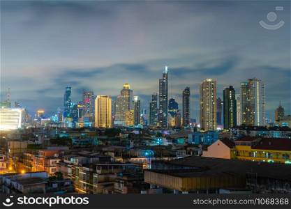Aerial view of Sathorn district, Bangkok Downtown. Thailand. Financial district and business centers in smart urban city in Asia. Skyscraper and high-rise buildings at night.