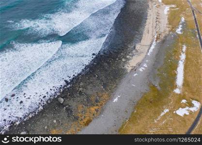 Aerial view of seascape at Skagsanden beach in Lofoten islands, Nordland county, Norway, Europe. Nature landscape background in winter season. Famous tourist attraction. Sunset sky