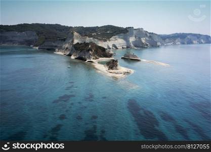 aerial view of sheer white cliffs of Cape Drastis near Peroulades village on Corfu Island in Greece 